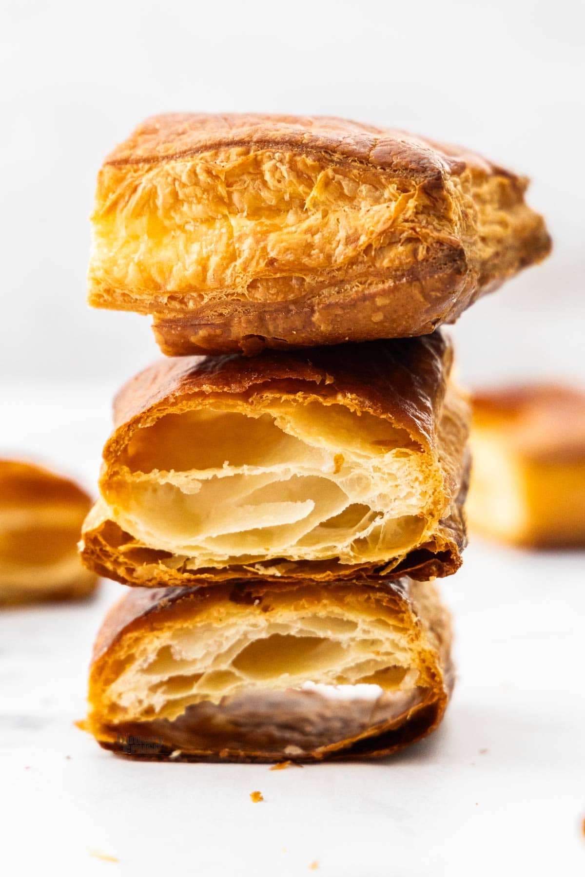 A stack of three pieces of puff pastry.