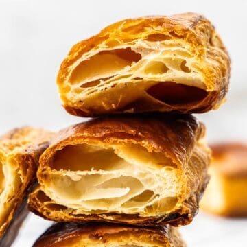 Extreme closeup of two pieces of homemade puff pastry.