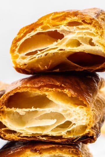 Extreme closeup of two pieces of homemade puff pastry.