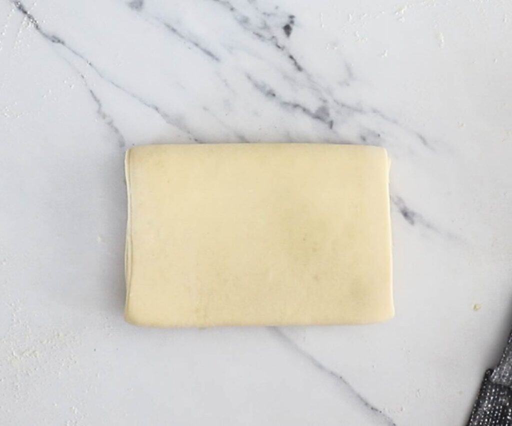 The dough folded in half - a double fold.