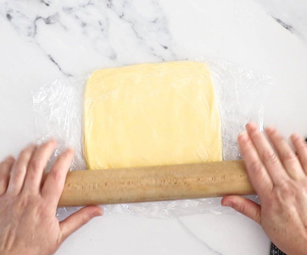 A butter block being rolled out.