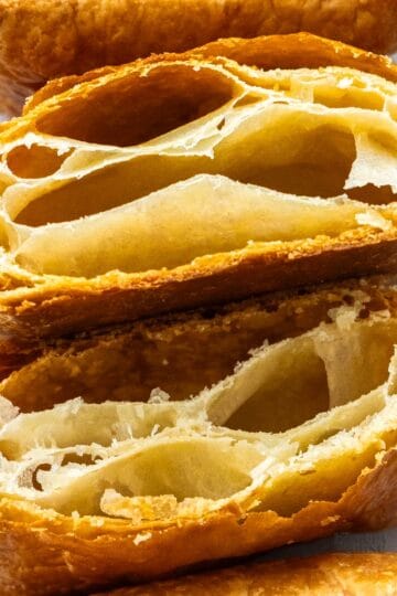 Two super-close up pieces of rough puff pastry.